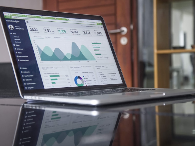 Corporate business website displayed on a desktop monitor showing clean professional design